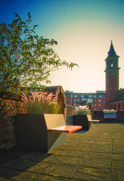 SLOPING BACK TIMBER BENCH PLANTER BY EUROPLANTERS STREET FURNITURE